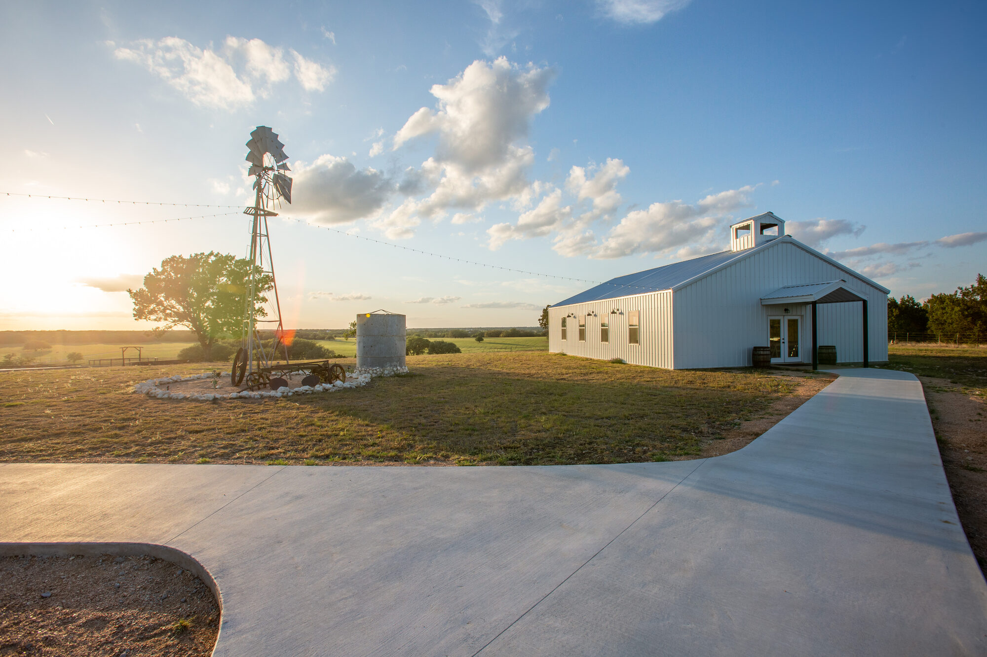 The Stanton Ranch event barn at golden hour in the Texas Hill Country